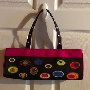 Jazzd shoulder bag.  Colorful Woven silk on black background.